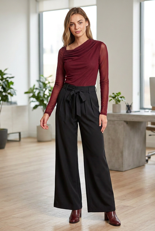 Business-casual outfit with the model’s hair swept behind her shoulders to reveal the burgundy top